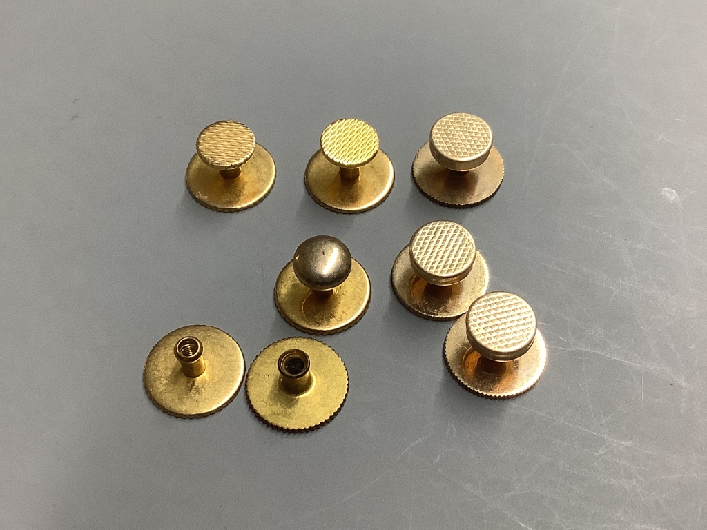 Three yellow metal dress studs, five gold plated dress studs, a 9ct chick bar brooch, a 15ct tie pin and a chalcedony set bob seal on a yellow metal chain